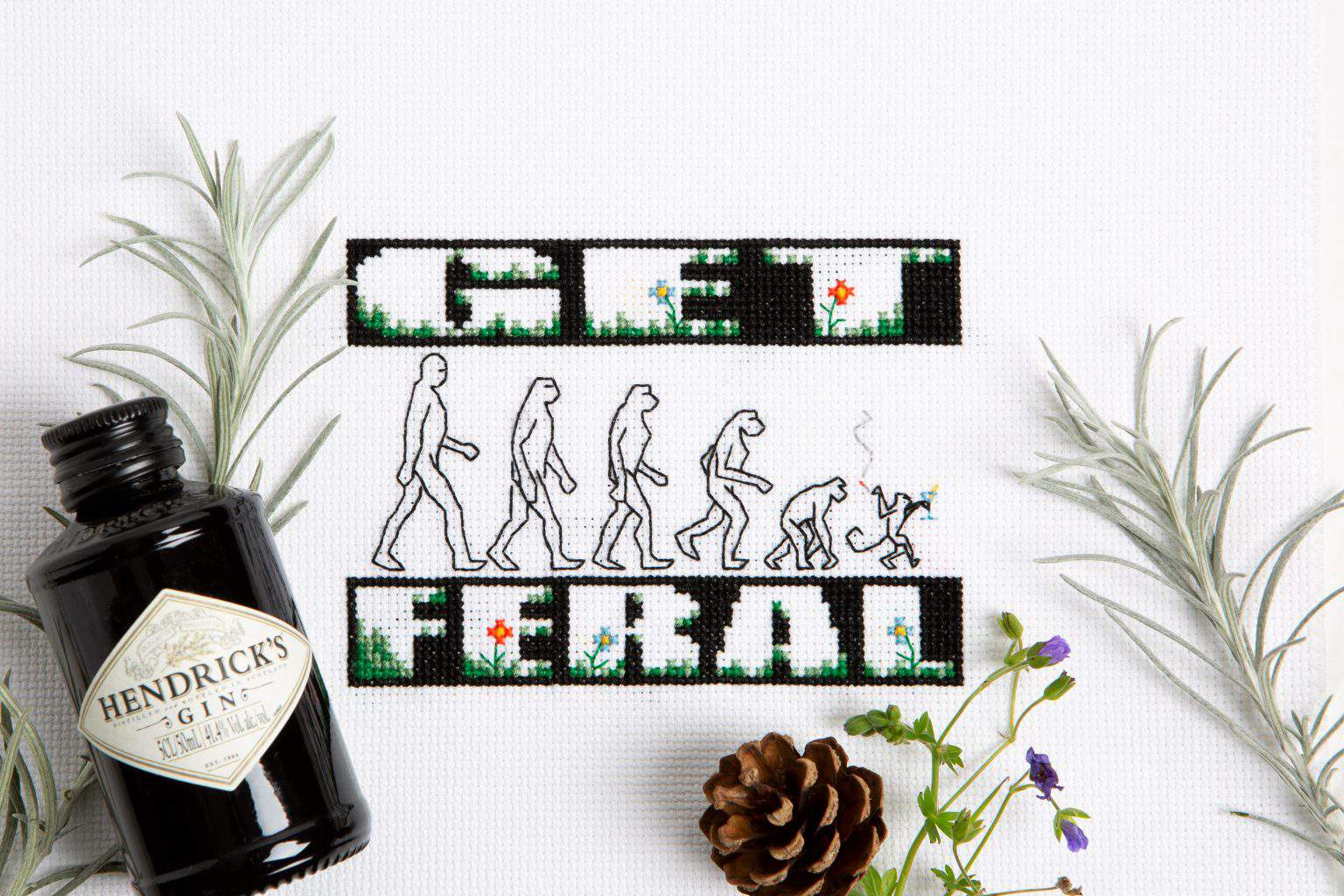 Cross-stitch pattern of human evolution with 'Get' and 'Relax' text from XStitch 2021 Calendar - Ref.
