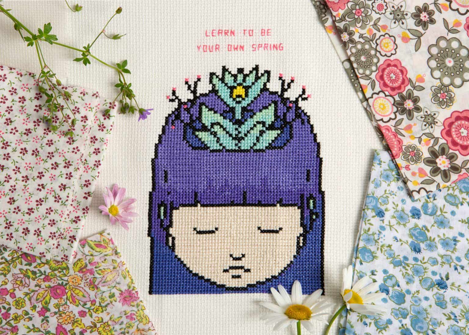 Cross-stitch pattern of a girl with a crown from XStitch 2021 Calendar - Reflex.